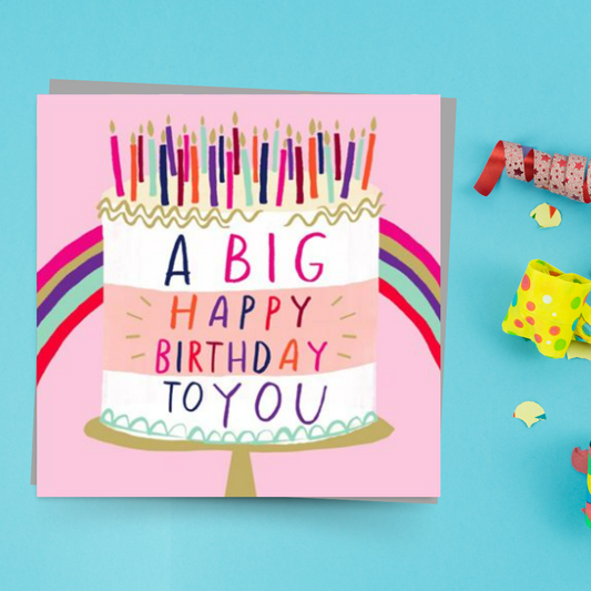 Square pink card with multicolour birthday cake and candles