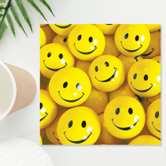 Square card full of smiley face yellow balls
