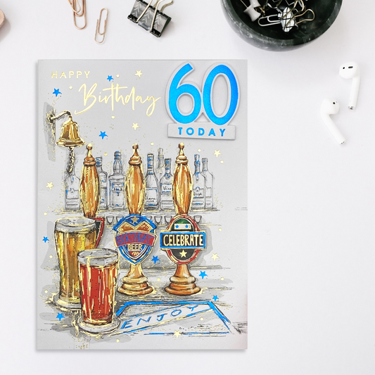 Front image of 60th Birthday card featuring beer pumps, pints and blue foil details