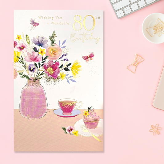 Pretty 80th Floral Tea party image with vase of flowers and pink cupcake and tea