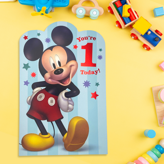 Front image of age 1 Mickey Mouse card. Red foil details