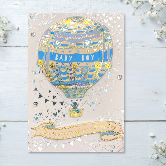 Front image showing blue and gold hot air balloon, bunting and bunny