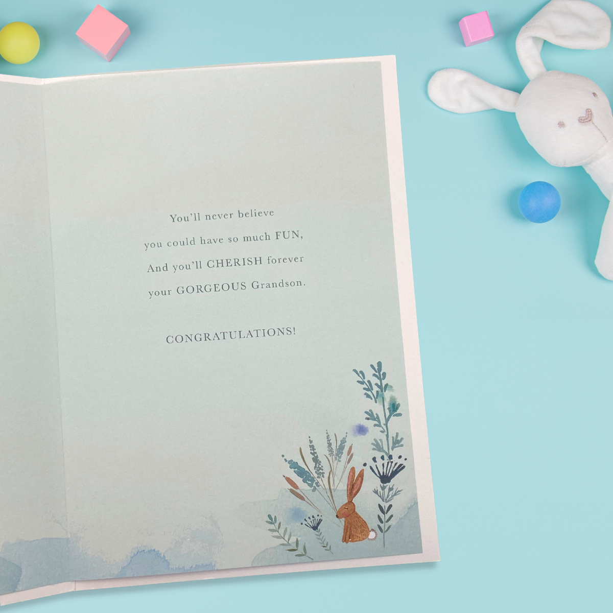 Inside image with blue printed insert and cute bunny in flowers