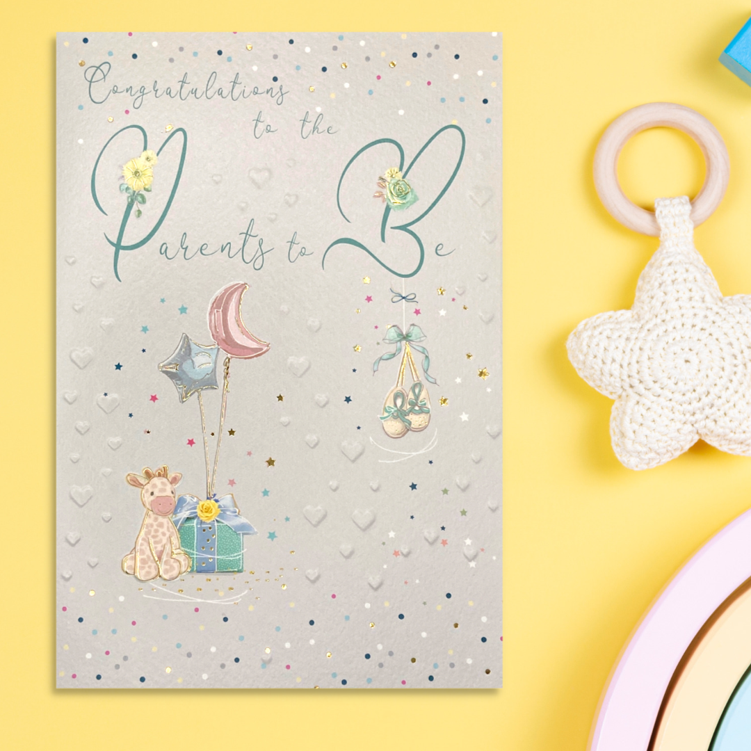 Front image with embossed hearts and cute giraffe, booties and balloons