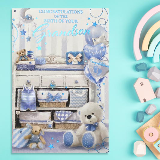 Front image with white dresser, surrounded but blue gifts and balloons