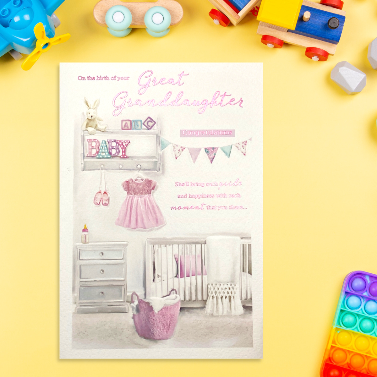 Front image with baby girls nursery image and pink foil text