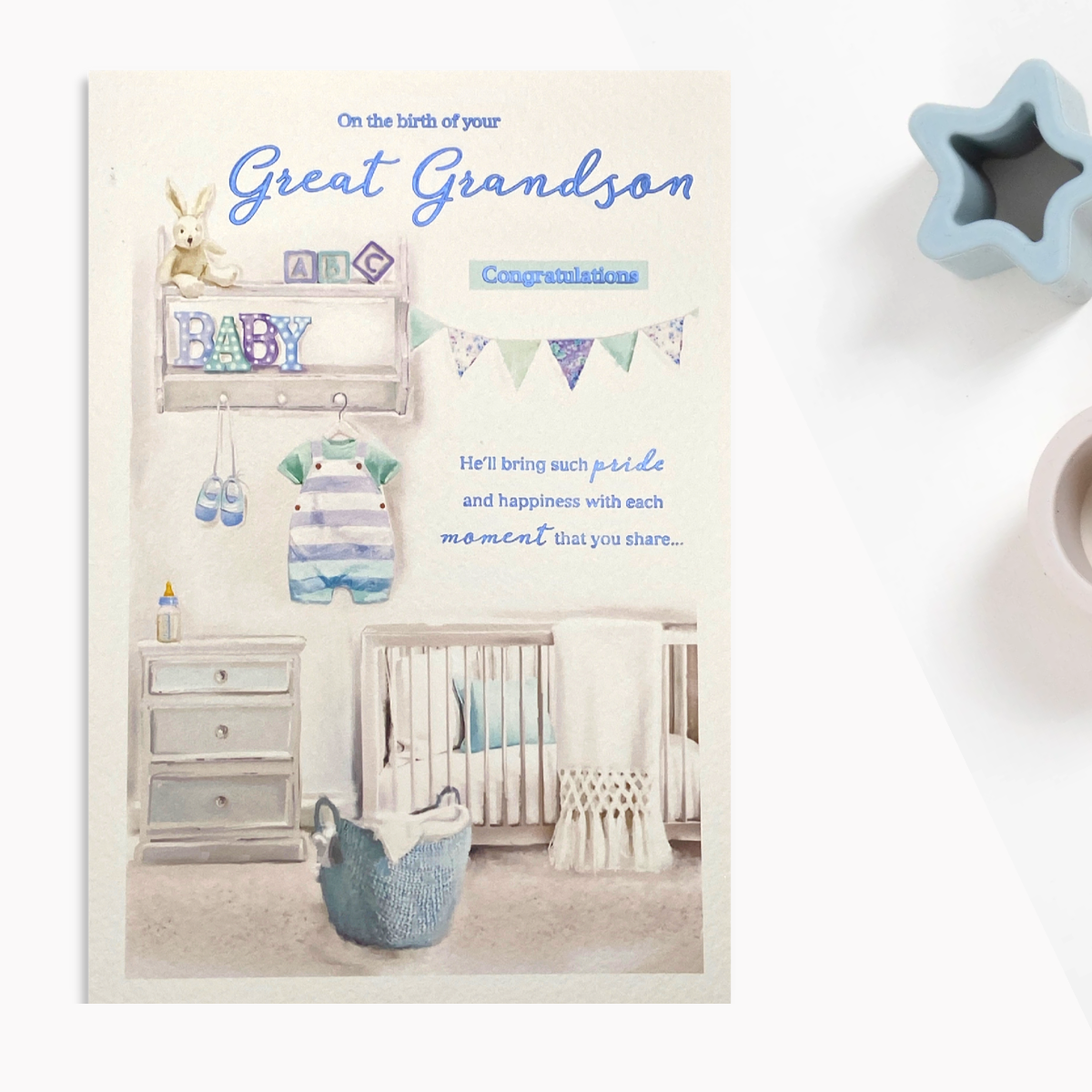 Front image with baby boy nursery and blue foil text