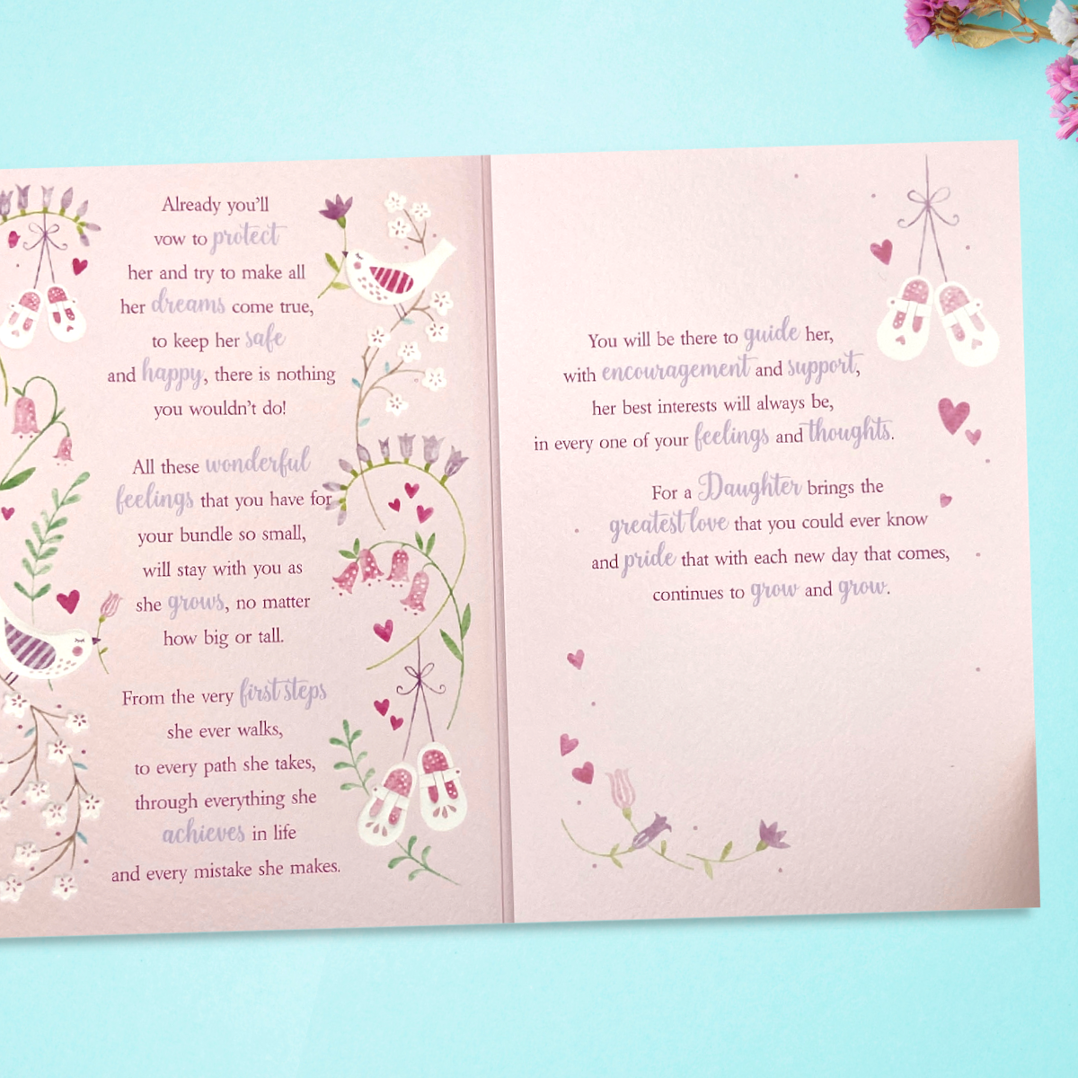 Inside image with two pink pages and verse with floral borders