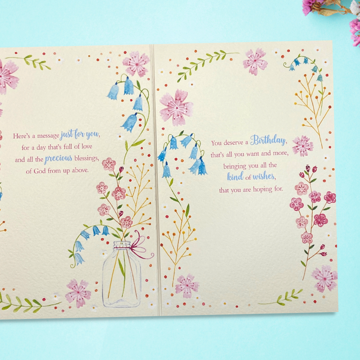 Two inside pages with floral border and verse