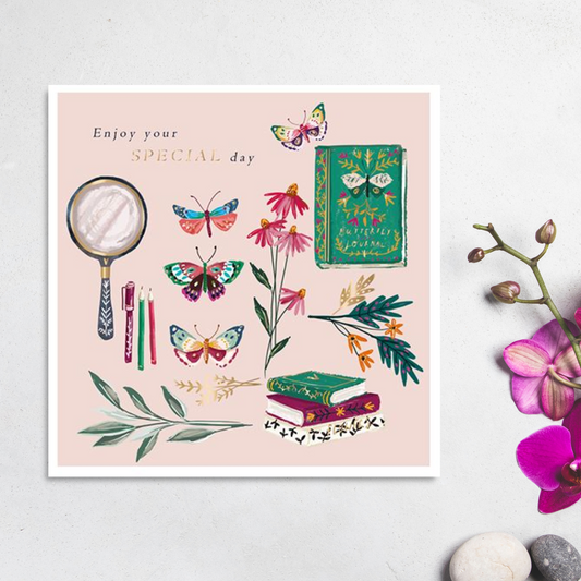 Square pink card with books, butterflies and magnifying glass