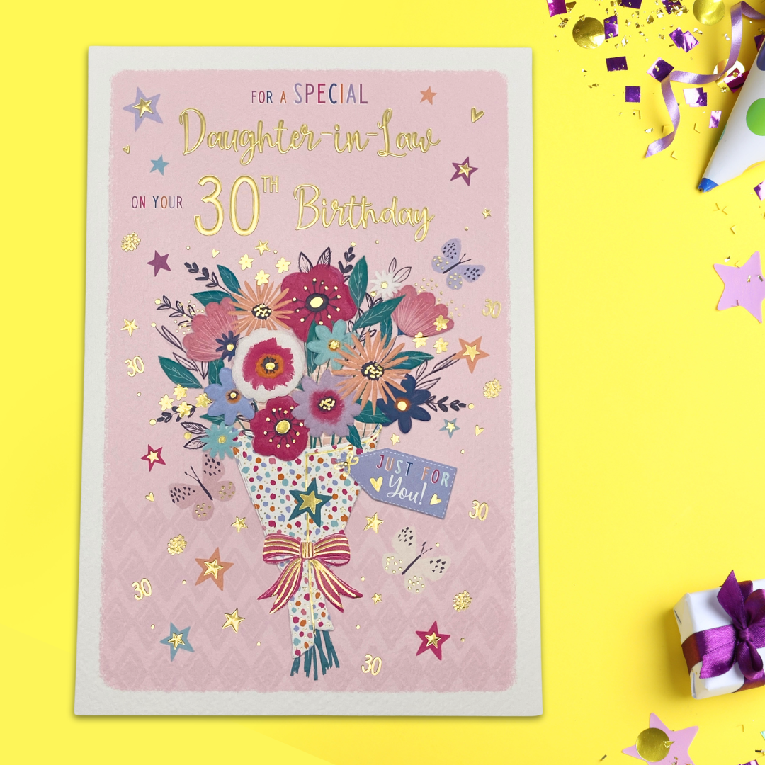 Pink card with floral bouquet and gold foil text