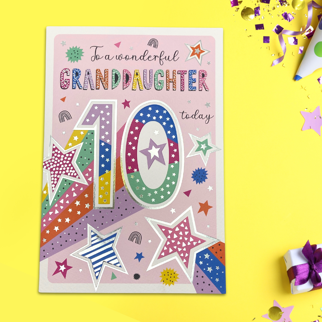 Brightly coloured text and stars with silver foil details