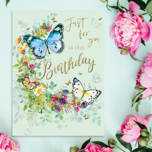 Mint green card with colourful flowers and butterflies