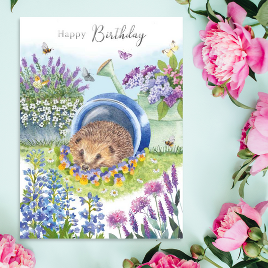 Cute hedgehog inside blue pot among flowers design