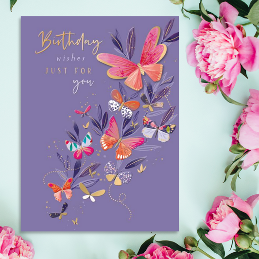Purple card with multiple butterflies and gold text