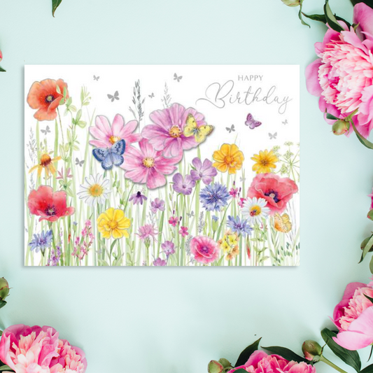 White card with wild flowers and grass theme