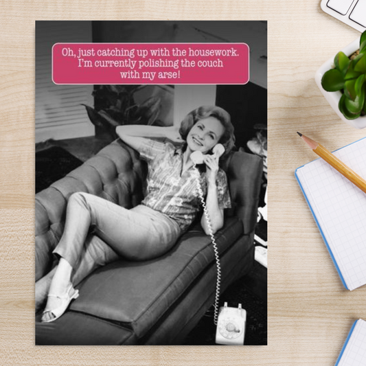 Black & White photgraphic card with funny caption of women laying on sofa on phone