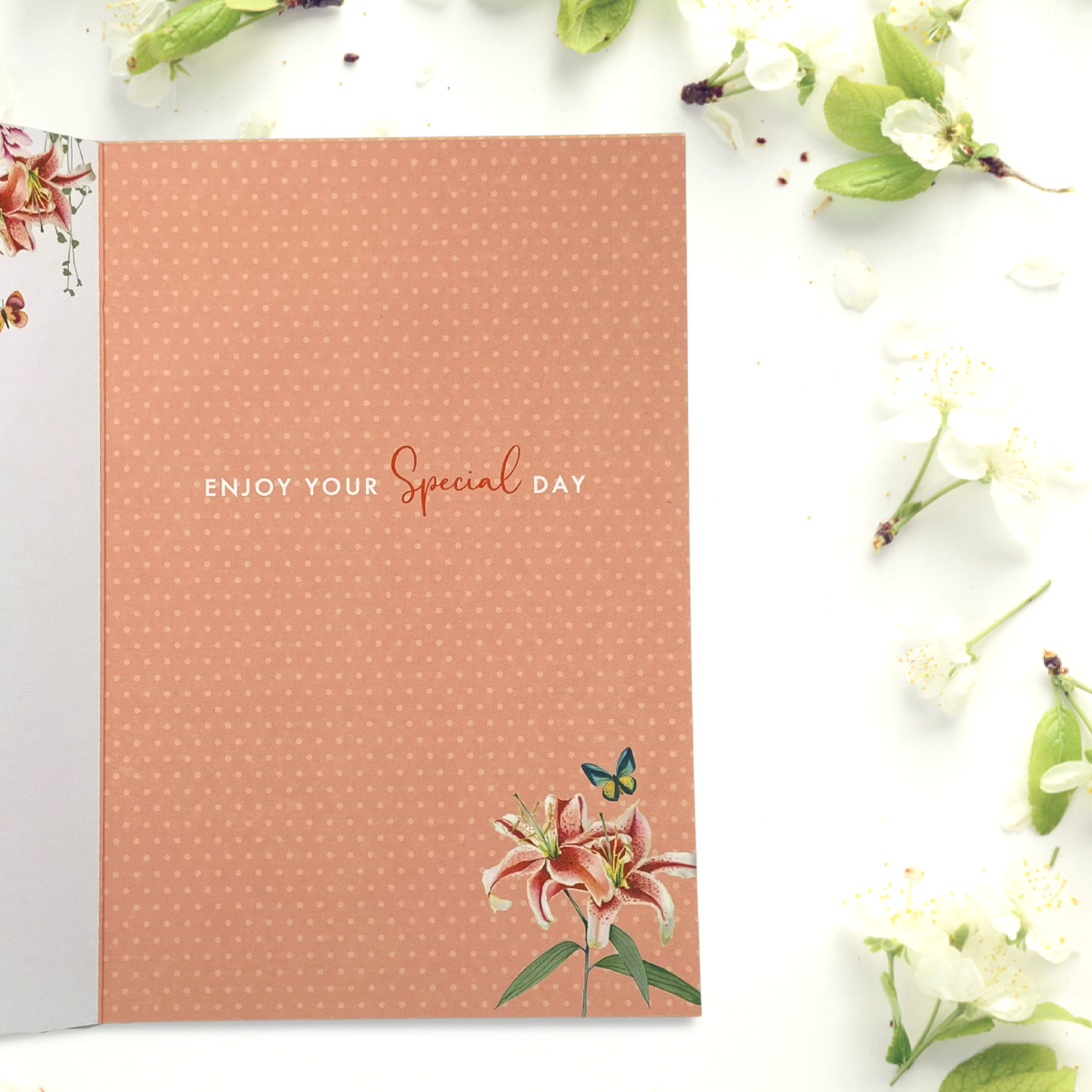 Inside card image with orange background, floral graphics and text