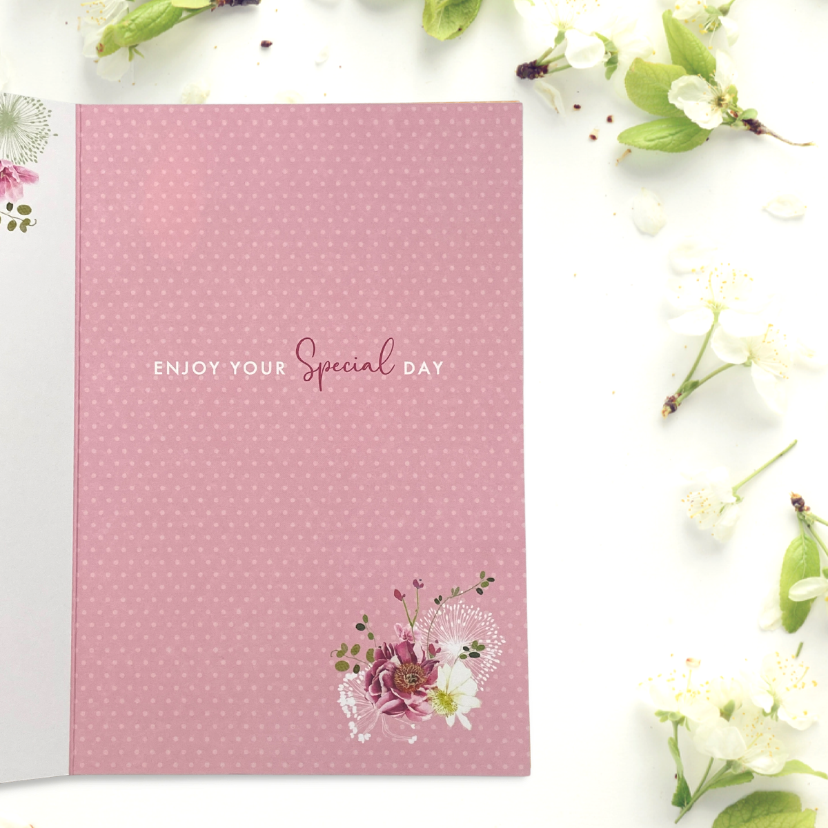 Inside image showing pink background with floral graphics and verse