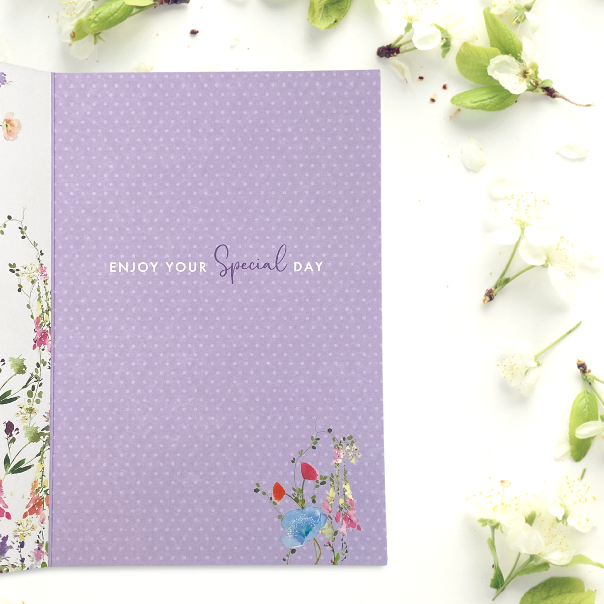 Inside image with purple background and flower details and verse