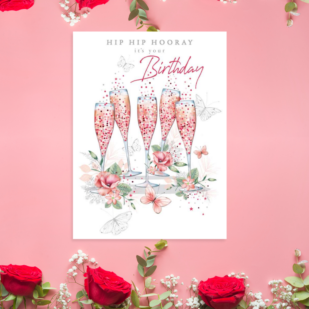 White Card with flutes and bubbly surrounded by pink flowers