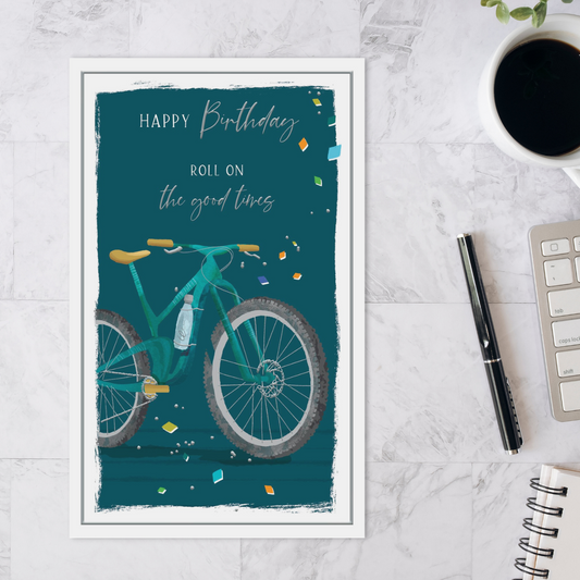 Green card with a mountain bike and confetti