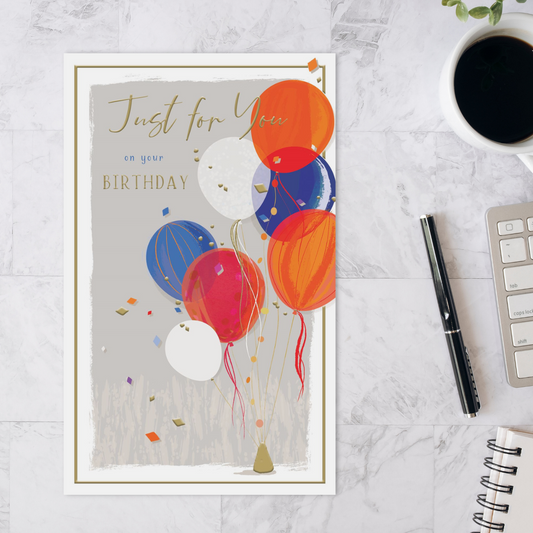 Orange and blue balloons with a gold border and text