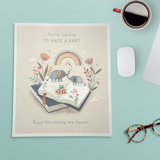 Cream card with books opened with elephant character and flowers, rainbows and white border