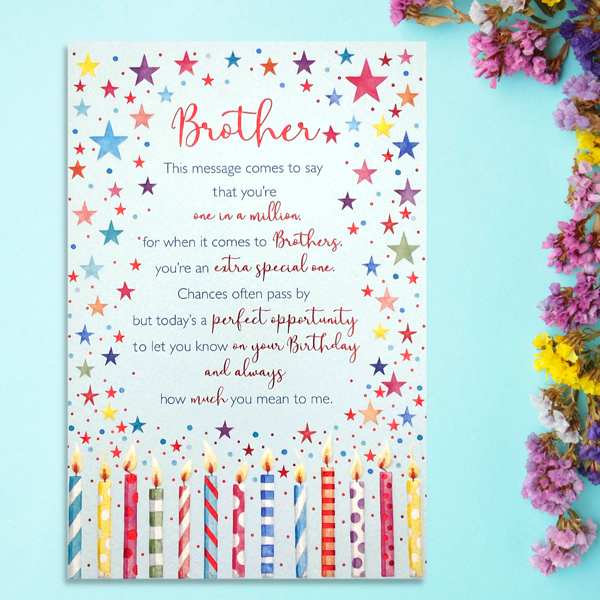 Front image showing candles, multicolour star border and verse