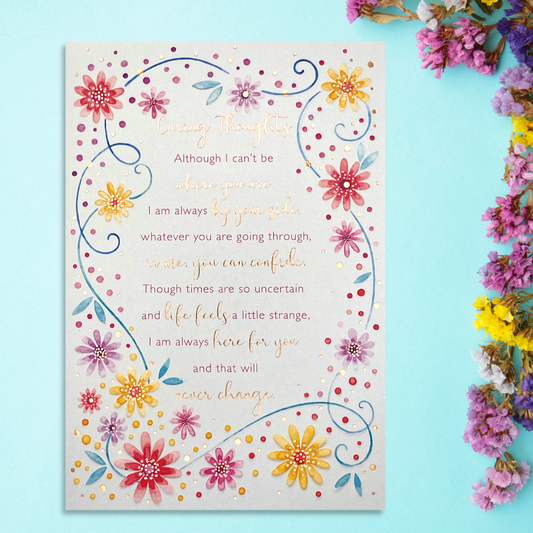 Front image showing multi coloured flower border with script verse