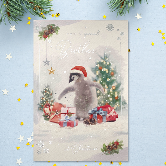 Front image with penguin in snow with christmas hat