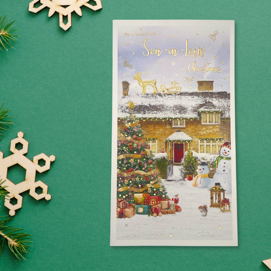 Slim Son in law card with decorated house in snow