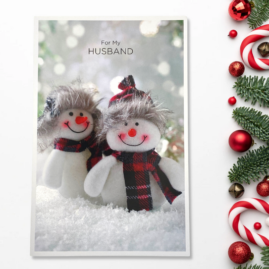 Two photographic snowmen with winter wear 