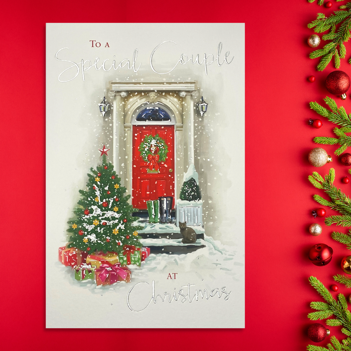 Red front door scene with christmas tree