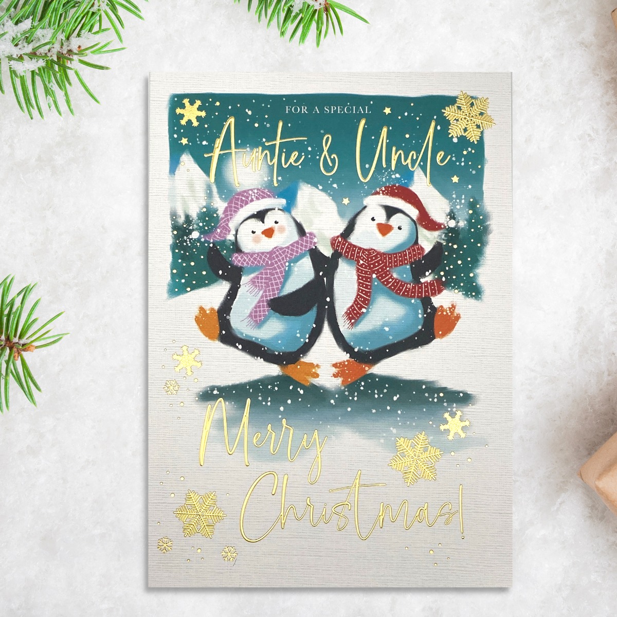 Cute penguin couple dancing in snow