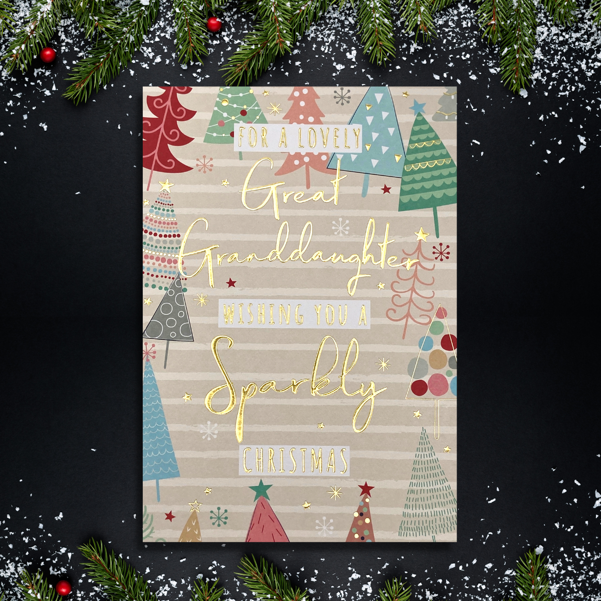 Pink card with decorated tree border and gold text