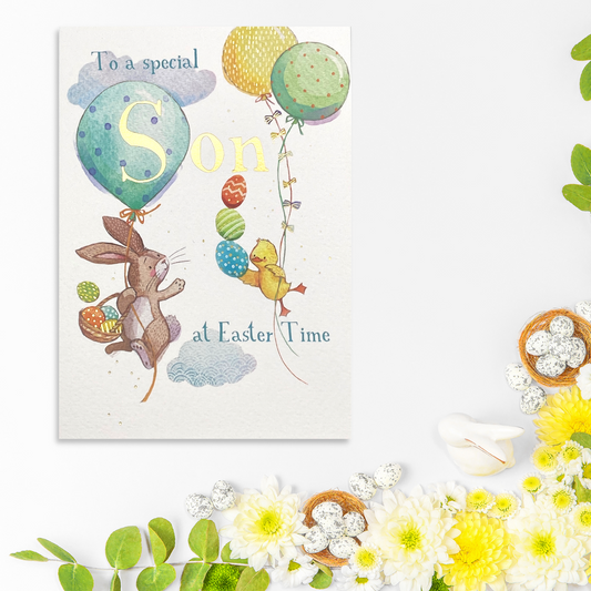 White card with bunny and chick holding onto balloons and easter eggs