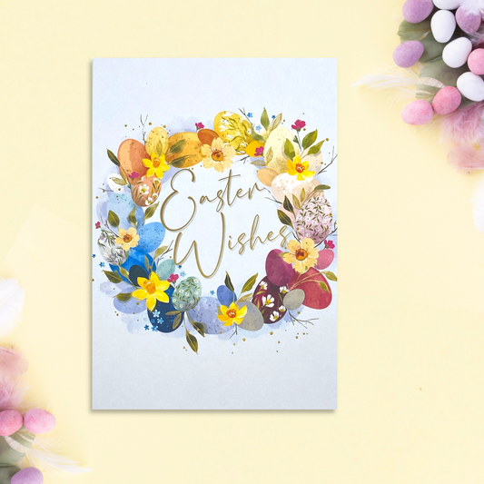 blue card with floral wreath and easter wishes text