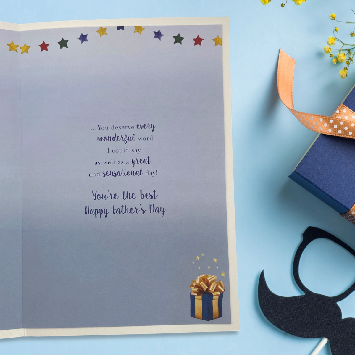 Inside image with colour printed insert showing gift, star bunting and verse