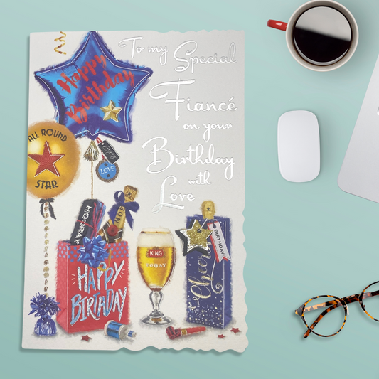 White card with die cut edge featuring blue balloon, bag and beer
