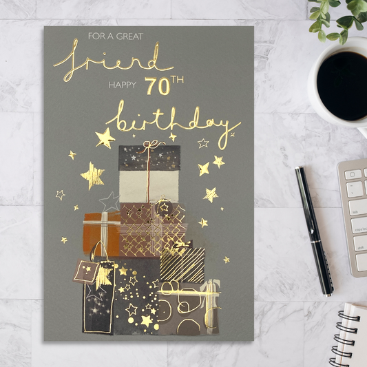 Grey card with stacked gifts with gold stars and details
