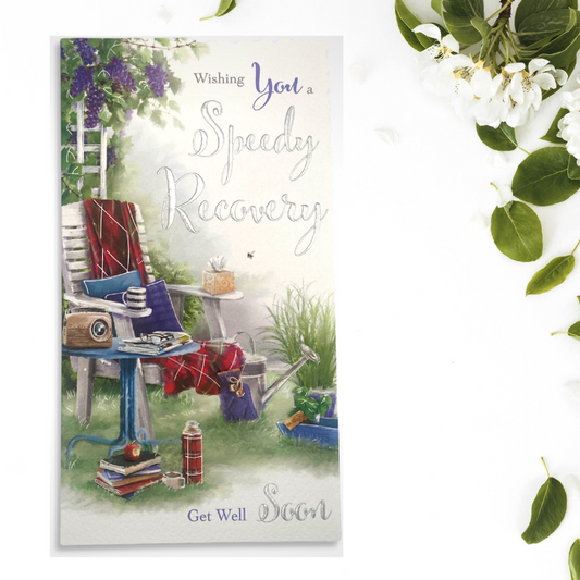 slim card featuring painted garden chair scene with books, flask and blanket