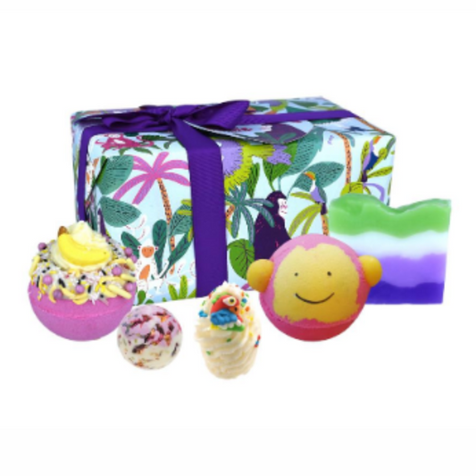 Jungle themed bath bomb gift set with parrot, monkey items and wrapped in jungle paper with purple ribbons