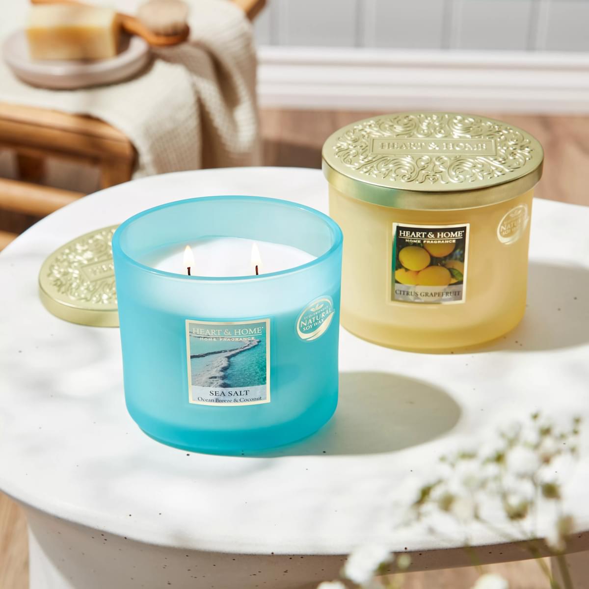 Lifestyle image with citrus grapefruit and sea salt candle on table together