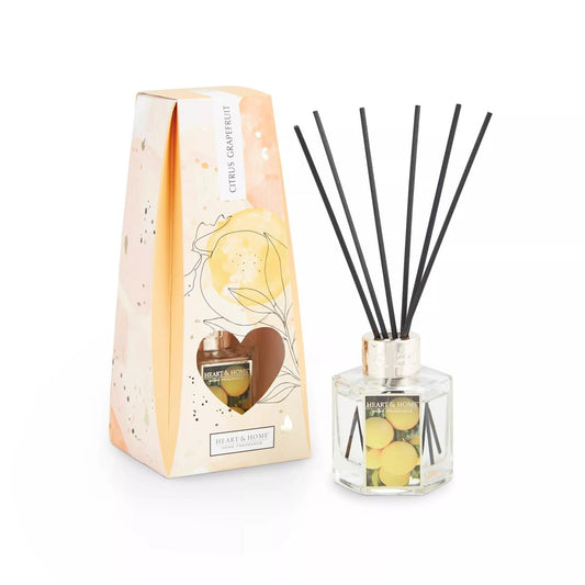 Pretty gift box with heart shaped cut out to display reed diffuser with black reeds