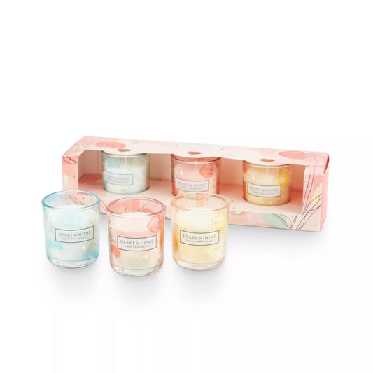 Three pastel votives in glass holders in floral gift box
