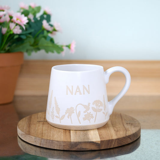 Nan Cottage Garden Mug Displayed On Wooden Coaster