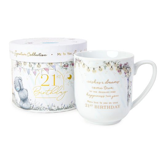 White box with sketched drawings and gold foil details on box and mug