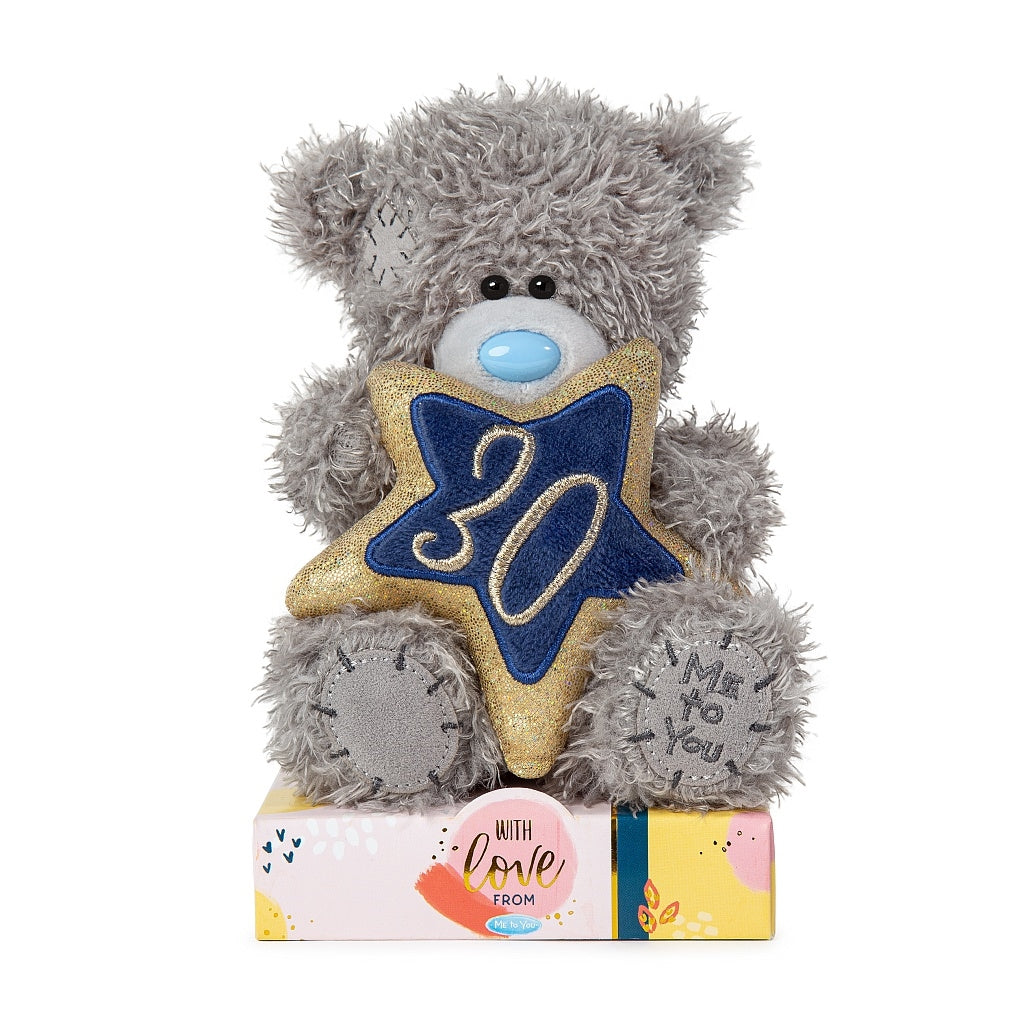 Tatty Teddy holding blue and gold 30th star on colourful base