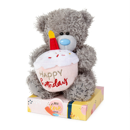 Front image with Tatty Teddy holding pink and red cupcake with candle